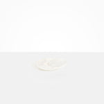 Dinosaur Designs Pebble Side Plate in Snow Swirl Colour resin