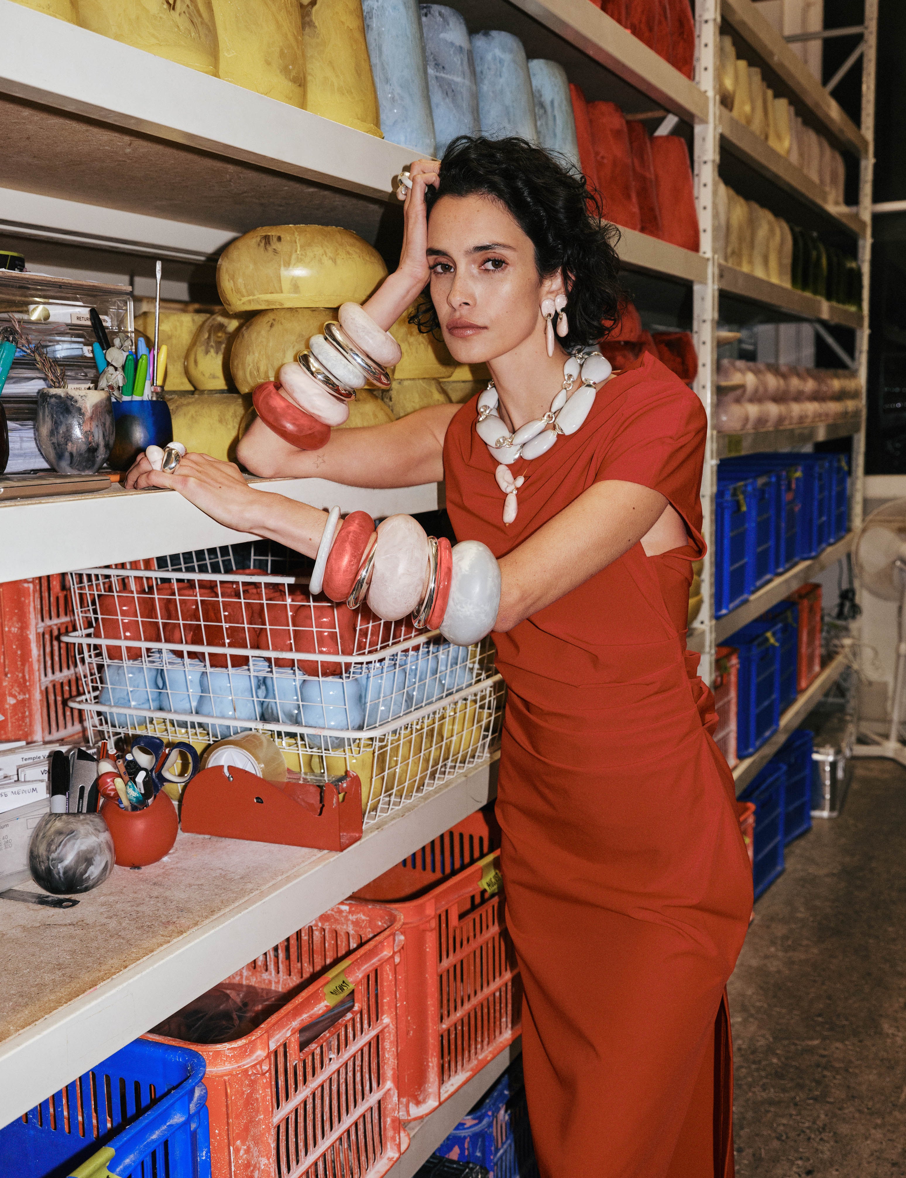 Model wearing bright coloured and silver bangles with grey choker