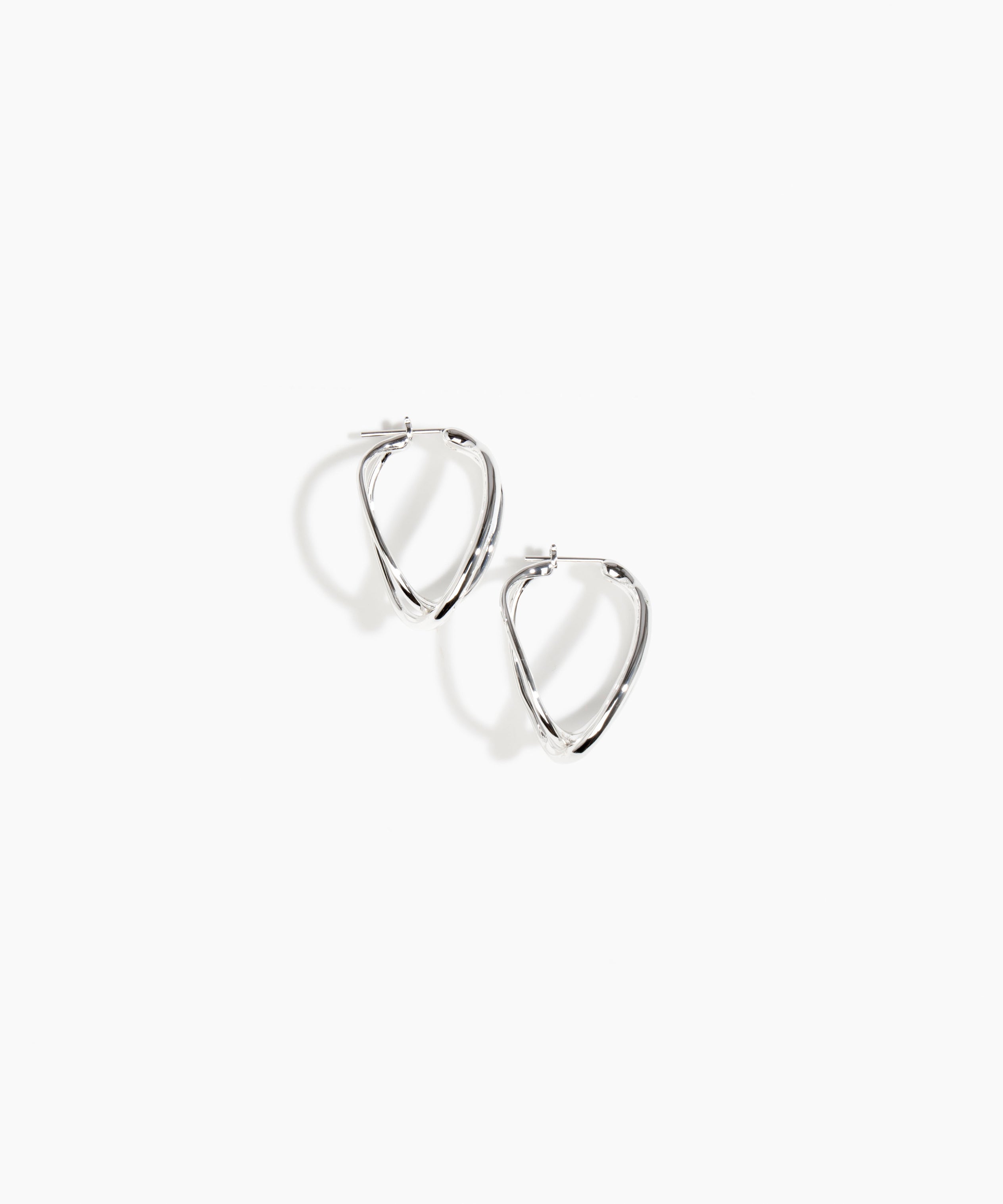 Dinosaur Designs and Alex & Trahanas Medium Corda Earrings in Silver — polished silver-toned plated hoop earrings with interlinked twisted loop design