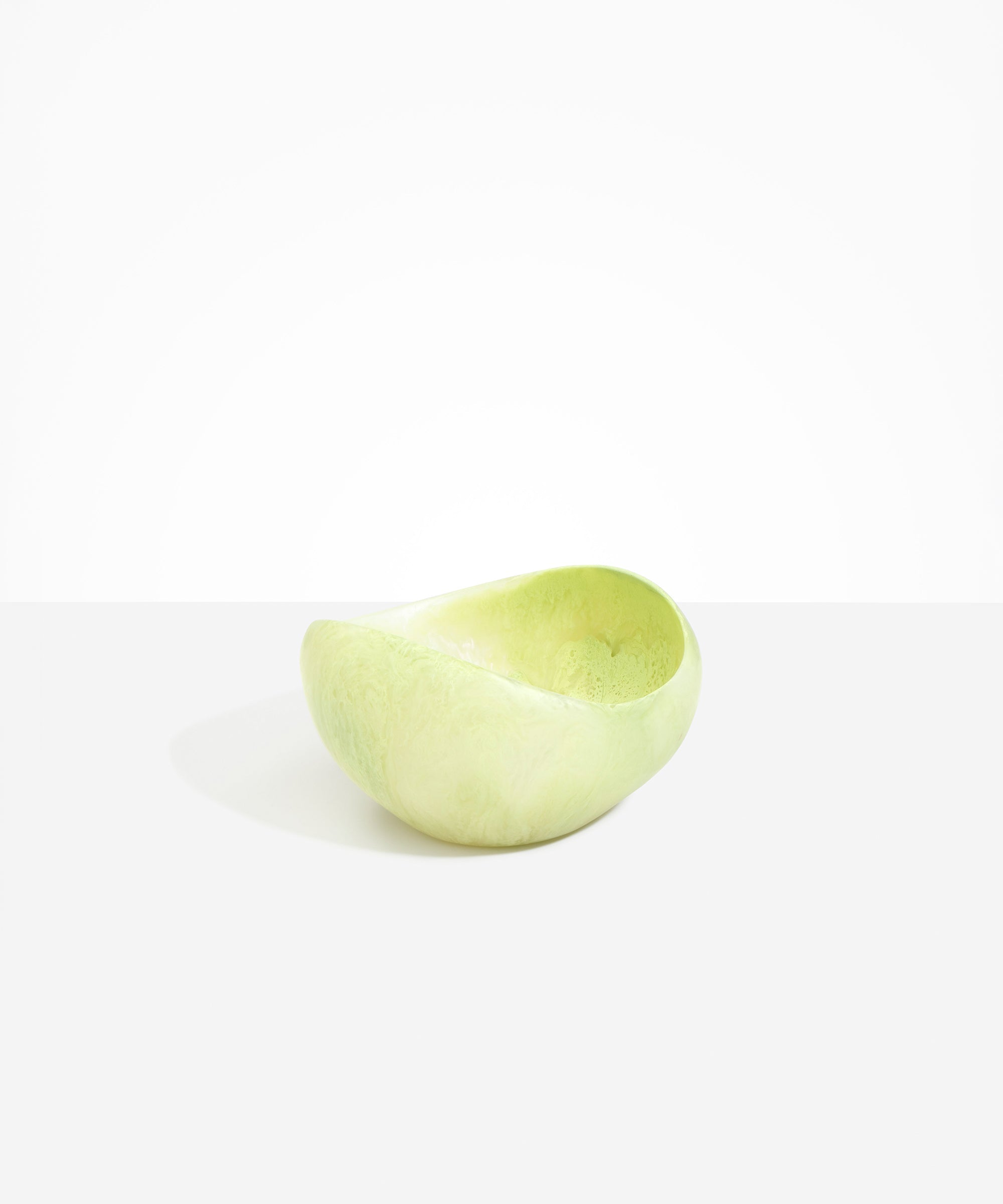Dinosaur Designs Large Beetle Bowl in Pistachio — handcrafted pale green resin bowl with rounded organic form and pinched open rim