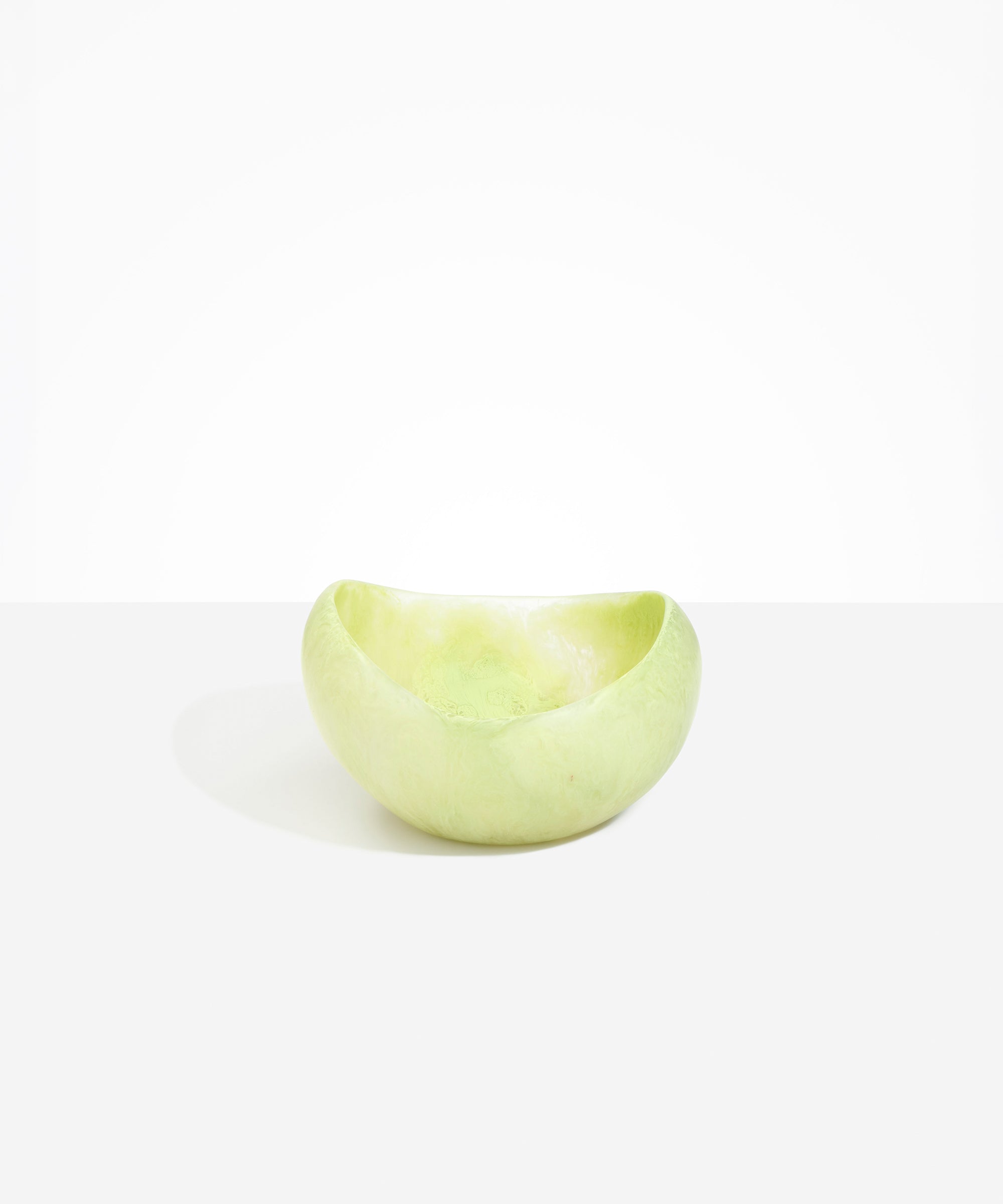 Dinosaur Designs Large Beetle Bowl in Pistachio — handcrafted pale green resin bowl with rounded organic form and pinched open rim