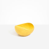 Dinosaur Designs Large Beetle Bowl in Pollen — handcrafted yellow resin bowl with rounded organic form and pinched open rim
