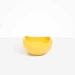 Dinosaur Designs Large Beetle Bowl in Pollen — handcrafted yellow resin bowl with rounded organic form and pinched open rim