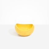 Dinosaur Designs Large Beetle Bowl in Pollen — handcrafted yellow resin bowl with rounded organic form and pinched open rim