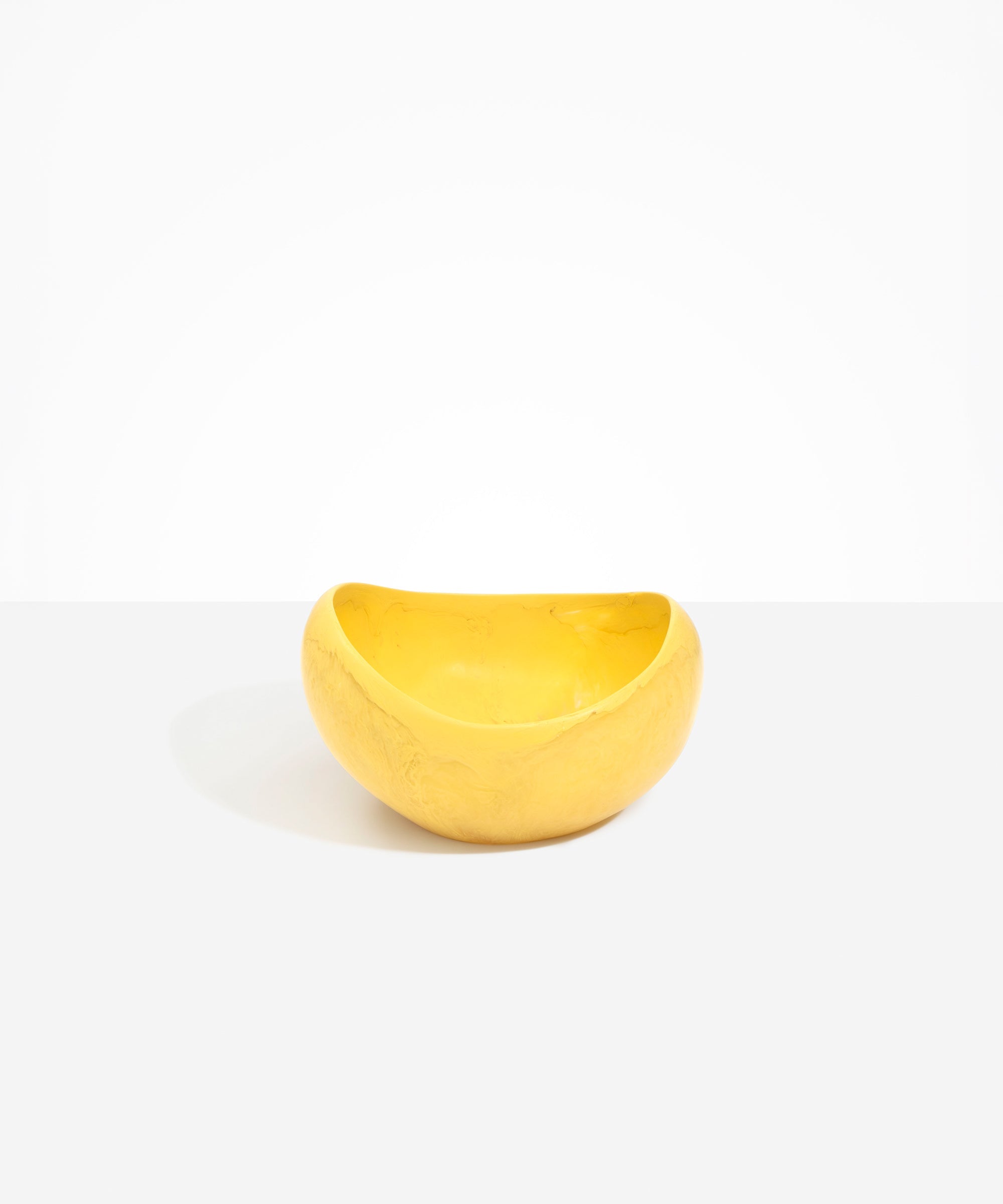 Dinosaur Designs Large Beetle Bowl in Pollen — handcrafted yellow resin bowl with rounded organic form and pinched open rim