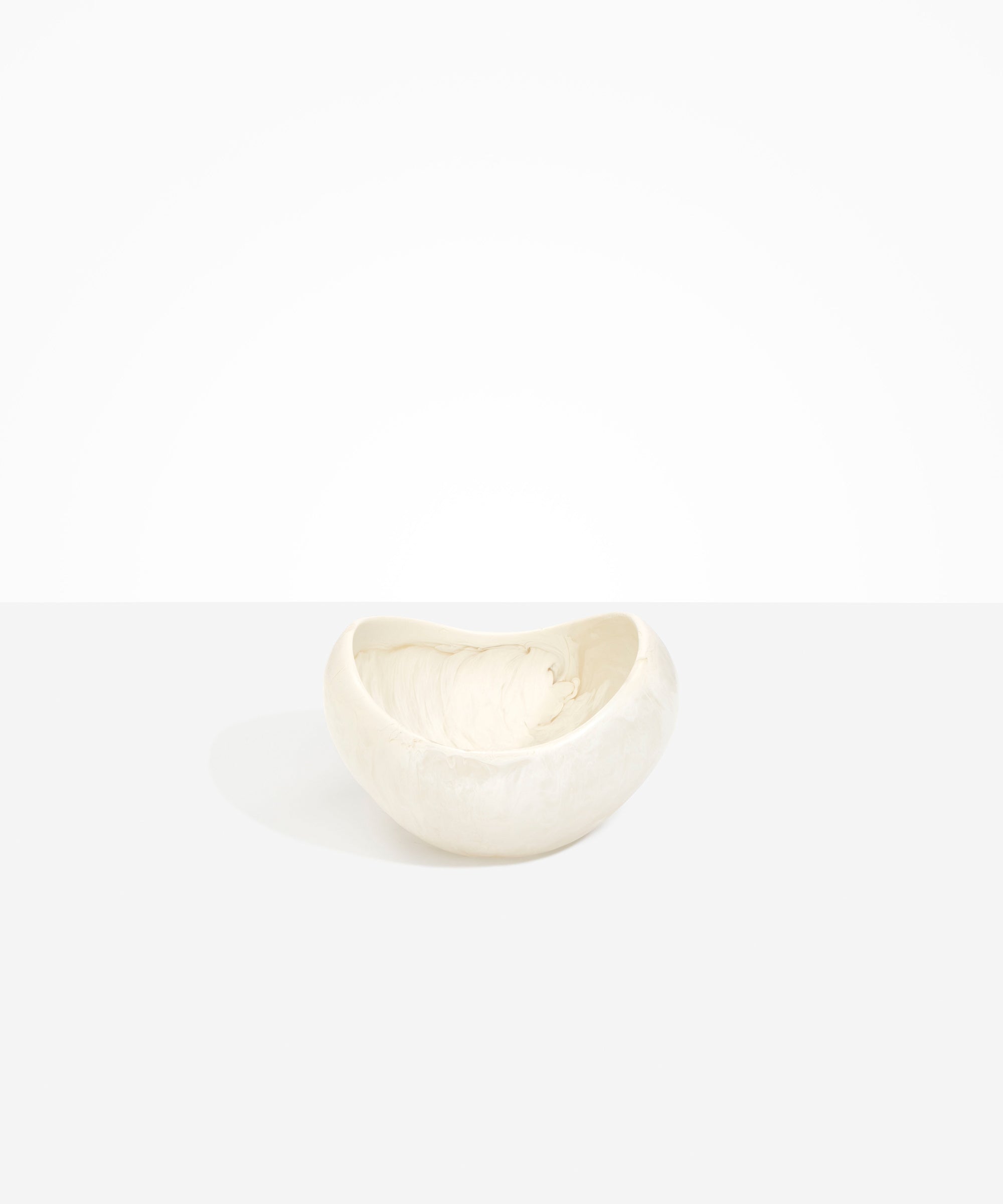 Dinosaur Designs Medium Beetle Bowl in Chalk Swirl — handcrafted off-white resin bowl with rounded organic form and pinched open rim