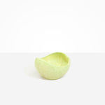 Dinosaur Designs Medium Beetle Bowl in Pistachio — handcrafted pale green resin bowl with rounded organic form and pinched open rim