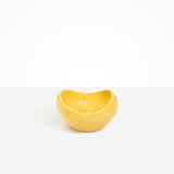 Dinosaur Designs Medium Beetle Bowl in Pollen — handcrafted yellow resin bowl with rounded organic form and pinched open rim