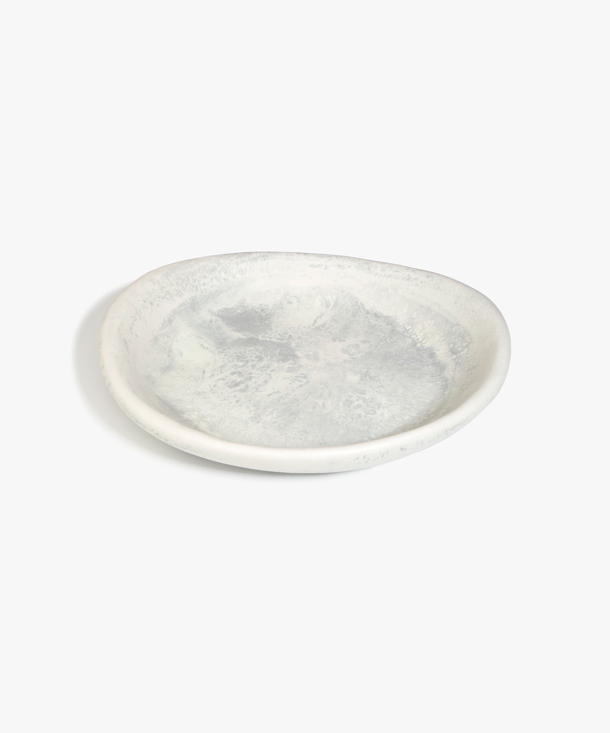 Dinosaur Designs Large Bones Bowl in Cloud — handmade marbled cream and grey resin shallow serving bowl with a rounded organic form..