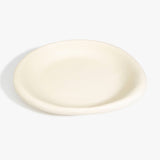 Dinosaur Designs Large Bones Bowl in Cream — handmade cream resin shallow serving bowl with a rounded organic form..