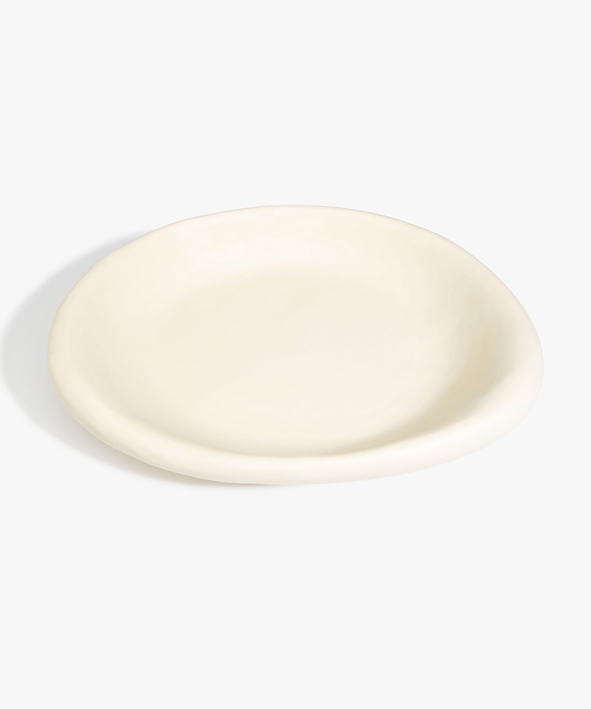 Dinosaur Designs Large Bones Bowl in Cream — handmade cream resin shallow serving bowl with a rounded organic form..
