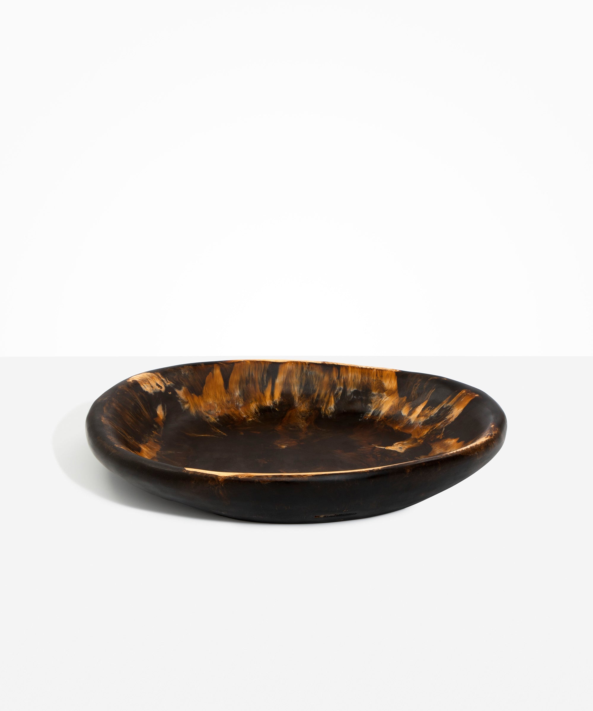 Dinosaur Designs Large Bones Bowl in Dark Horn —  handmade marbled brown, black and gold resin shallow serving bowl with a rounded organic form