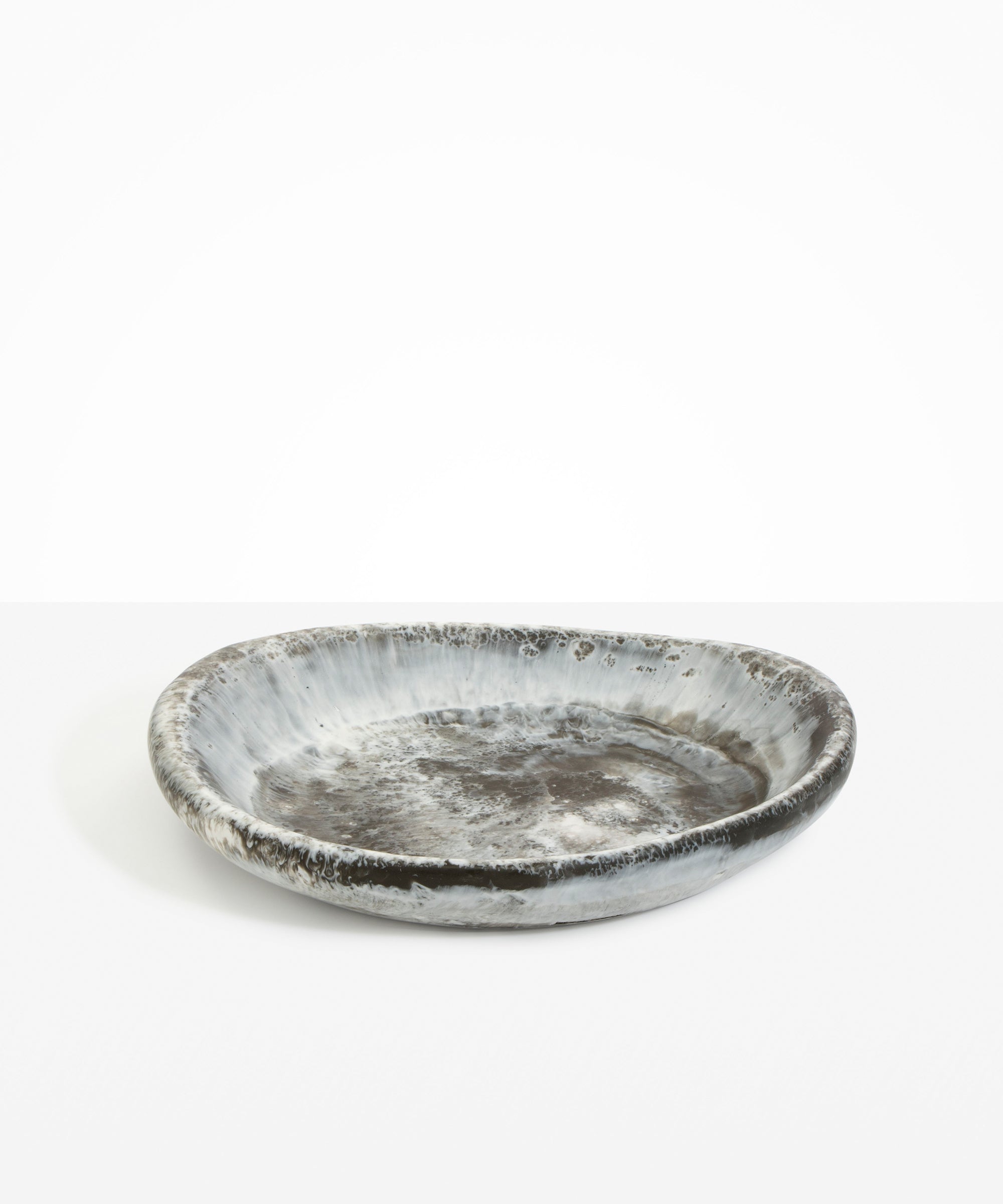 Dinosaur Designs Large Bones Bowl in Granite — handmade marbled cream and grey resin shallow serving bowl with a rounded organic form..