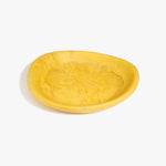 Dinosaur Designs Large Bones Bowl in Pollen — handmade marbled yellow resin shallow serving bowl with a rounded organic form..
