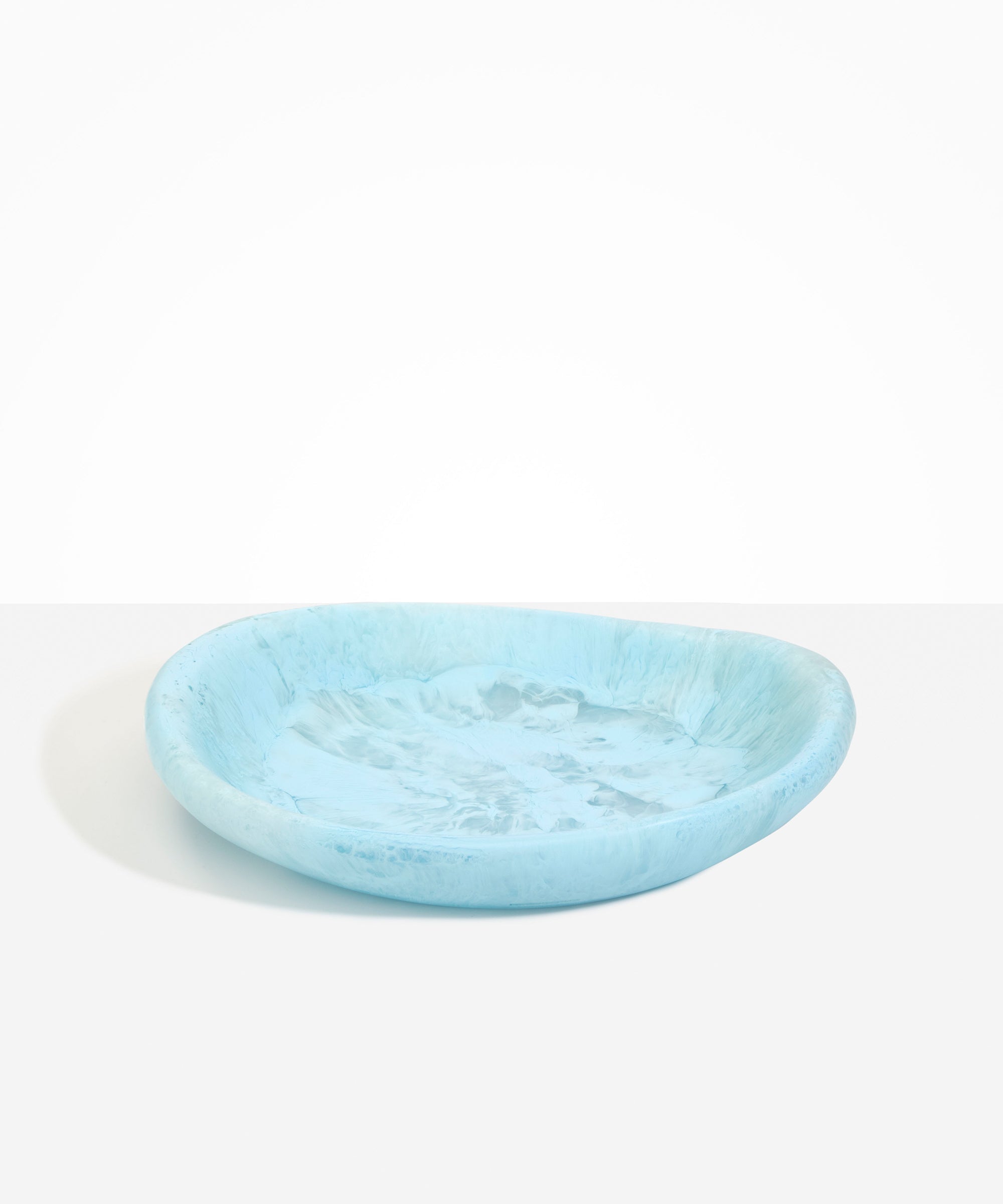 Dinosaur Designs Large Bones Bowl in Pool — handmade marbled blue resin shallow serving bowl with a rounded organic form