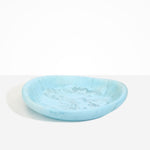 Dinosaur Designs Large Bones Bowl in Pool — handmade marbled blue resin shallow serving bowl with a rounded organic form..
