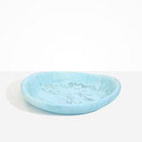Dinosaur Designs Large Bones Bowl in Pool — handmade marbled blue resin shallow serving bowl with a rounded organic form..