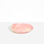 Dinosaur Designs Small Bones Bowl in Blossom — small handmade marbled pink and cream resin shallow serving bowl with a rounded organic form