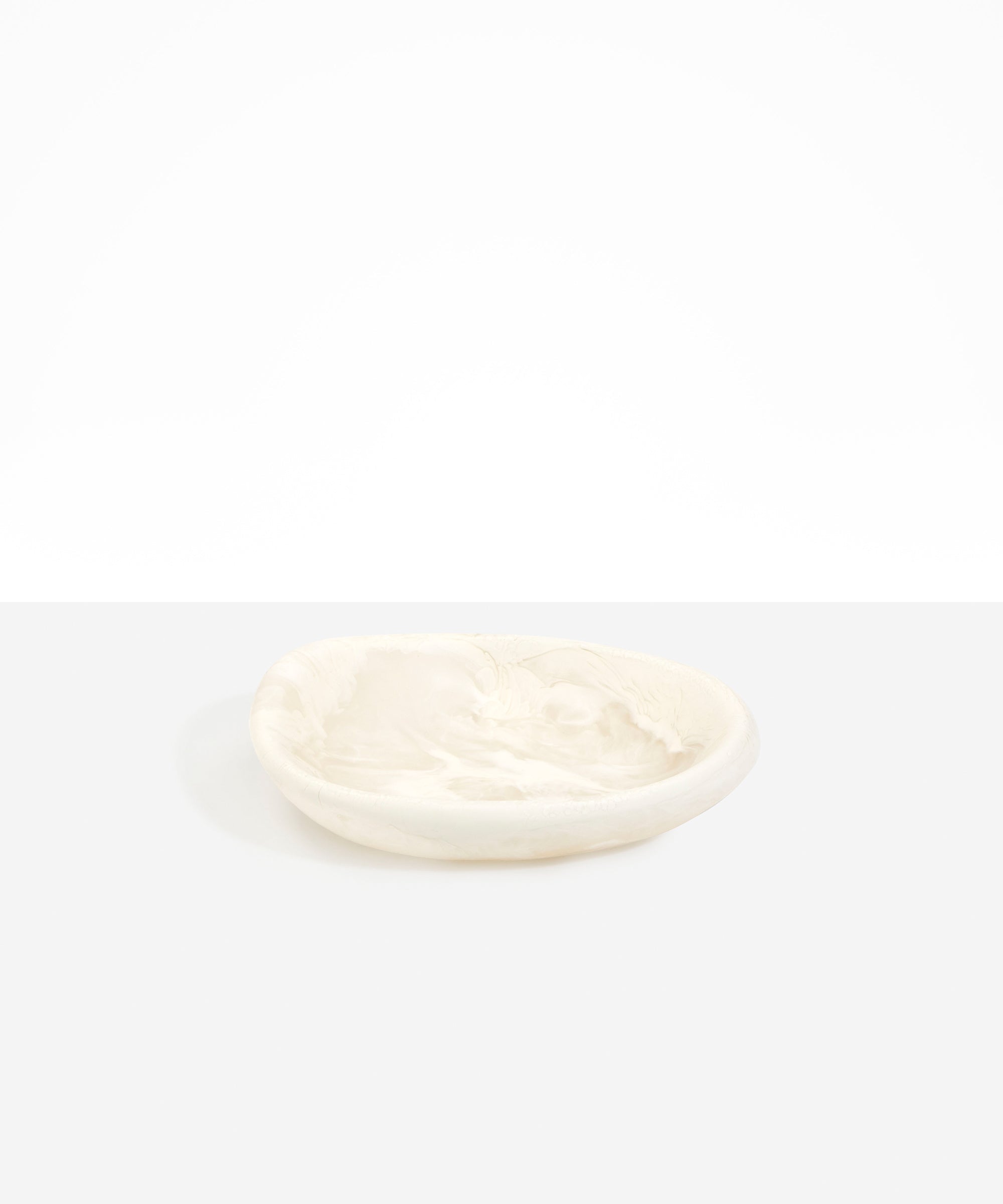 Dinosaur Designs Small Bones Bowl in Chalk Swirl — small handmade marbled off-white resin shallow serving bowl with a rounded organic form