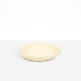 Dinosaur Designs Small Bones Bowl in Cream — small handmade cream resin shallow serving bowl with a rounded organic form