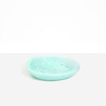 Dinosaur Designs Small Bones Bowl in Mint — small handmade marbled green blue resin shallow serving bowl with a rounded organic form