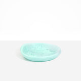 Dinosaur Designs Small Bones Bowl in Mint — small handmade marbled green blue resin shallow serving bowl with a rounded organic form