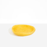 Dinosaur Designs Small Bones Bowl in Pollen — small handmade marbled yellow resin shallow serving bowl with a rounded organic form