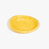 Dinosaur Designs Small Bones Bowl in Pollen — small handmade marbled yellow resin shallow serving bowl with a rounded organic form