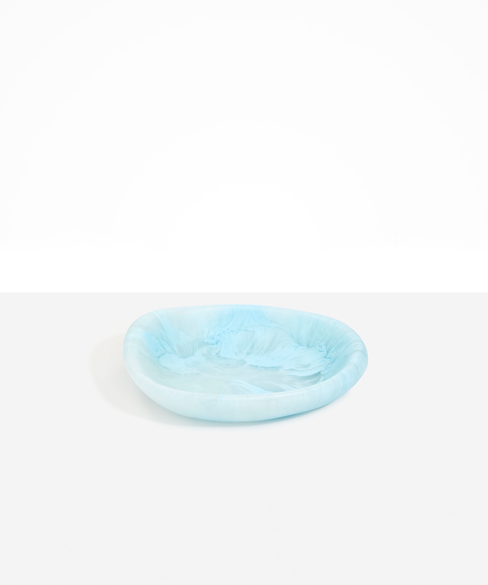 Dinosaur Designs Small Bones Bowl in Pool — small handmade marbled blue resin shallow serving bowl with a rounded organic form