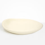 Dinosaur Designs Extra Large Bones Bowl in Cream —  handmade cream resin shallow decorative bowl with a rounded organic form