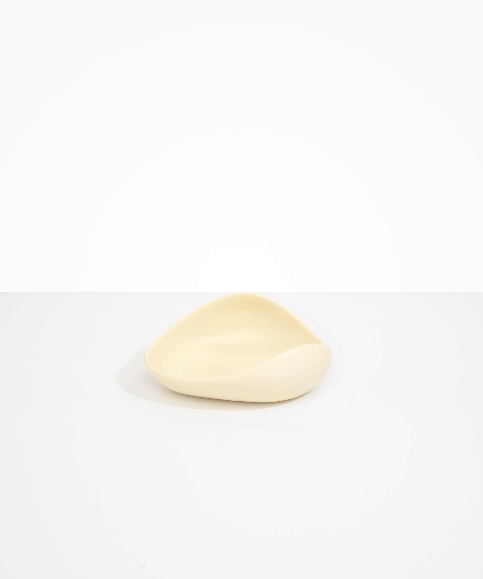 Dinosaur Designs Small Leaf Bowl in Cream — handcrafted cream resin bowl with curved organic form