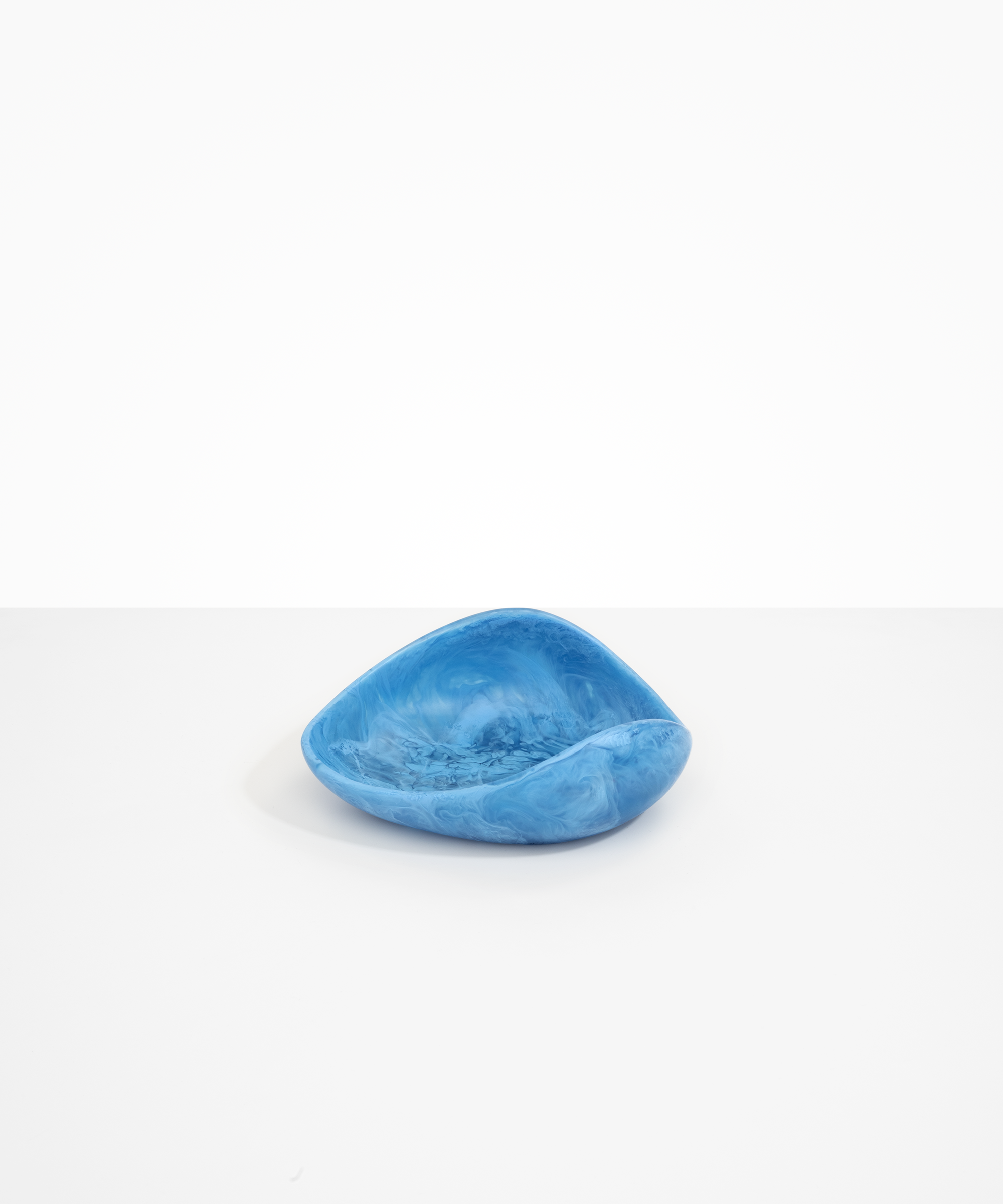 Dinosaur Designs Small Leaf Bowl in Sky — handcrafted marbled blue resin bowl with curved organic form