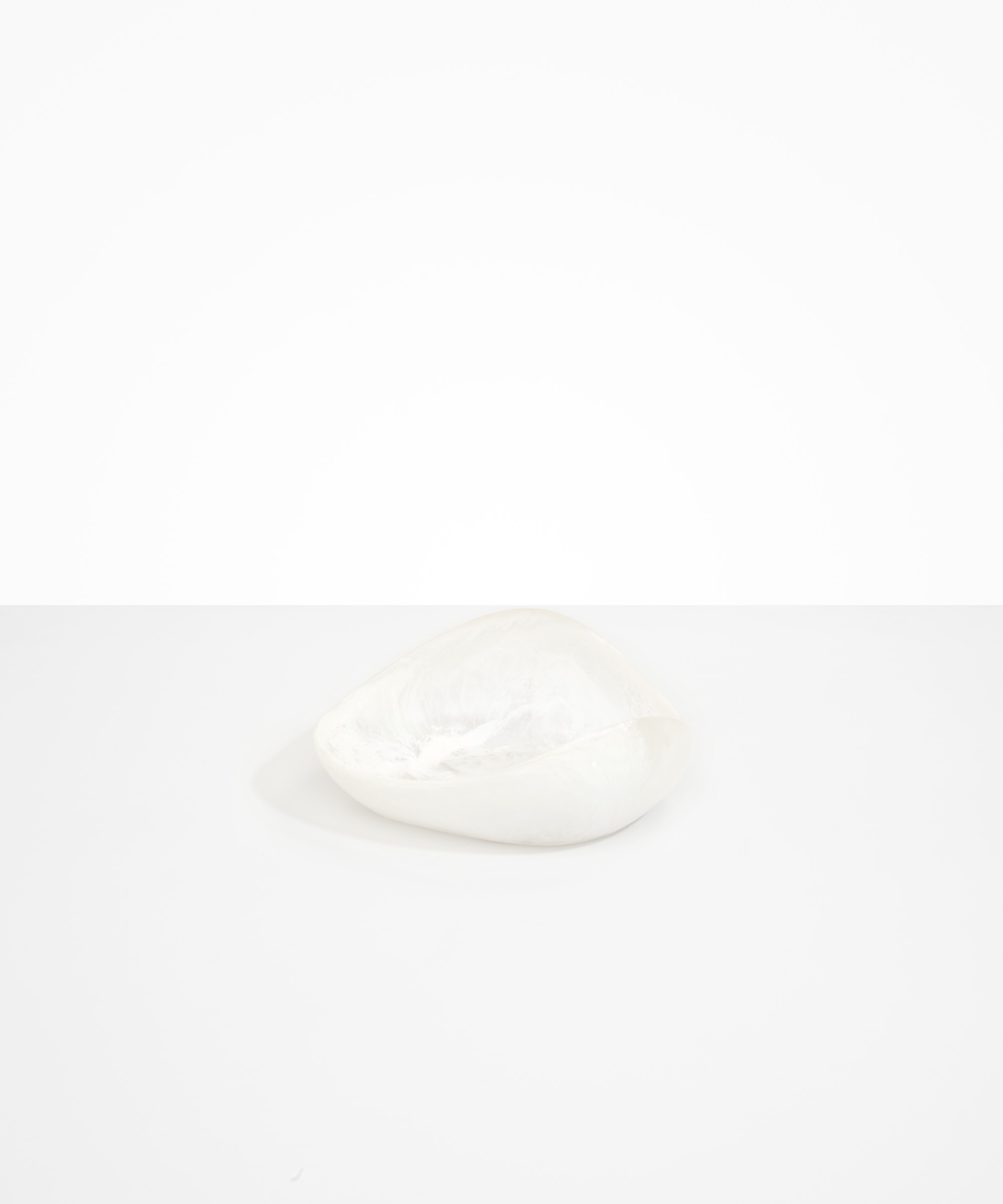 Dinosaur Designs Small Leaf Bowl in Snow Swirl — handcrafted white and transparent resin bowl with curved organic form