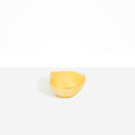 Dinosaur Designs Petal Dessert Bowl in Pollen — handcrafted marbled yellow resin bowl with curved form and pinched organic rim