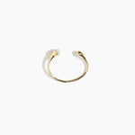 Dinosaur Designs Polished Lotus Cuff in Chalk Swirl with Brass — open brass cuff bracelet with asymmetric marbled off-white resin and polished brass teardrop