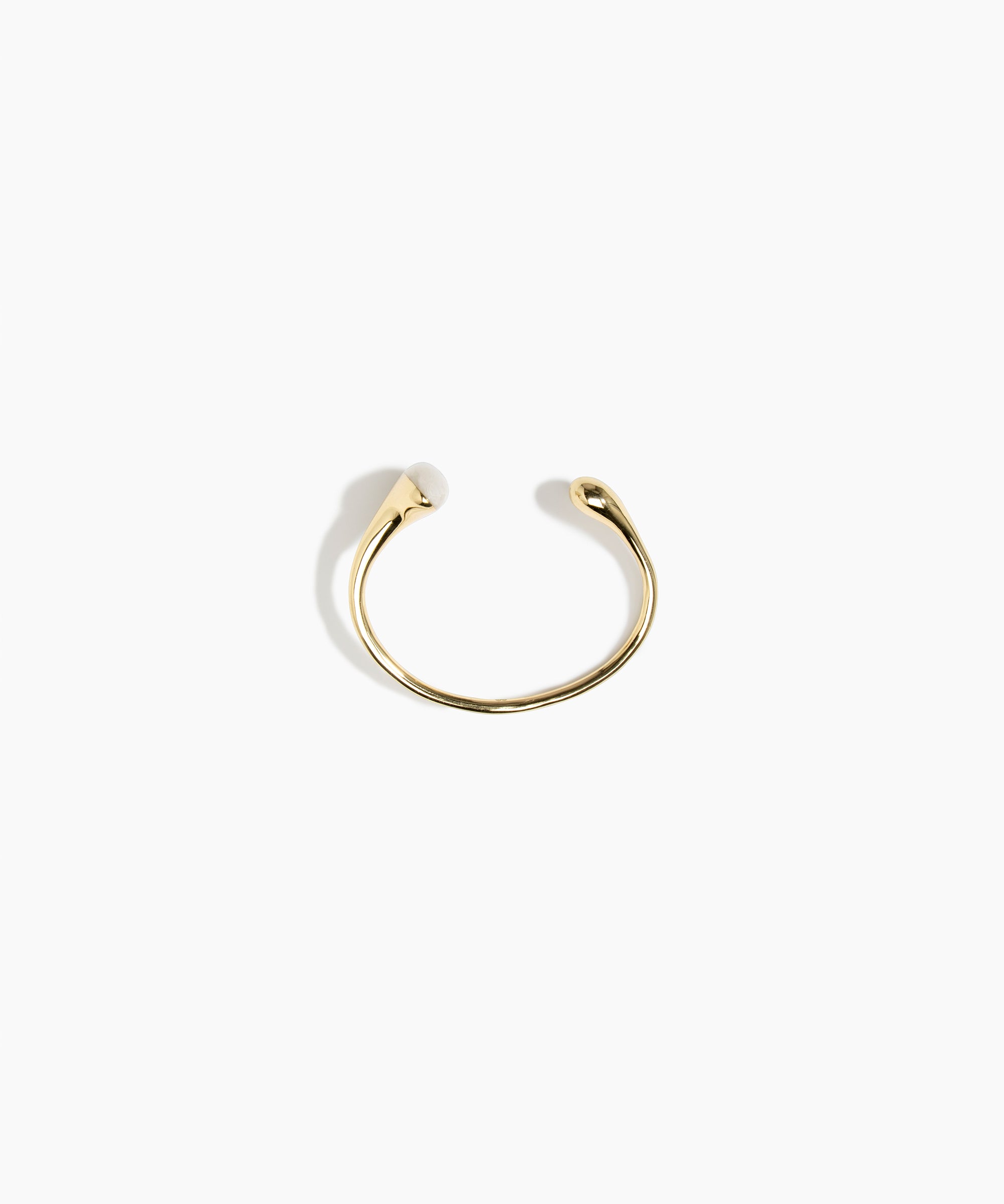 Dinosaur Designs Polished Lotus Cuff in Chalk Swirl with Brass — open brass cuff bracelet with asymmetric marbled off-white resin and polished brass teardrop
