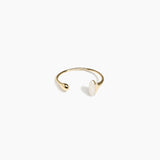 Dinosaur Designs Polished Lotus Cuff in Chalk Swirl with Brass — open brass cuff bracelet with asymmetric marbled off-white resin and polished brass teardrop