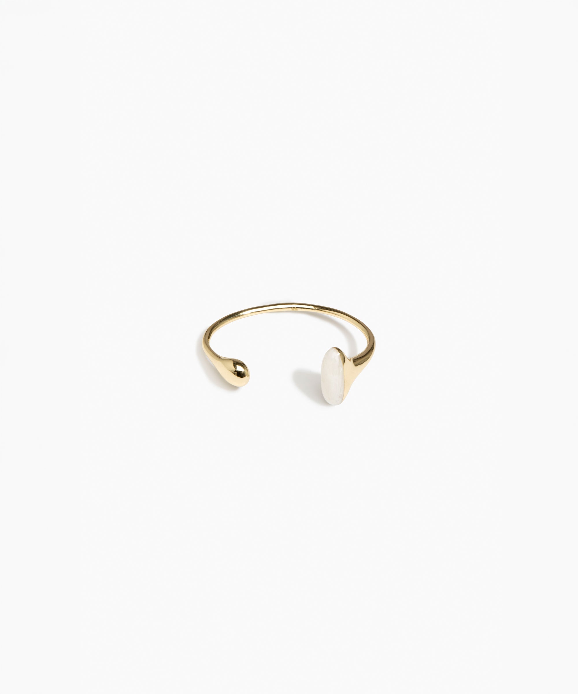 Dinosaur Designs Polished Lotus Cuff in Chalk Swirl with Brass — open brass cuff bracelet with asymmetric marbled off-white resin and polished brass teardrop