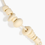 Dinosaur Designs Drift Choker in Cream with Plated-Silver — cream resin pebble beads on a wood silk cord with silver-plated end cap