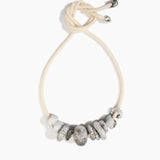 Dinosaur Designs Drift Choker in Granite with Plated-Silver — marbled cream and grey resin pebble beads on a wood silk cord with silver-plated end cap