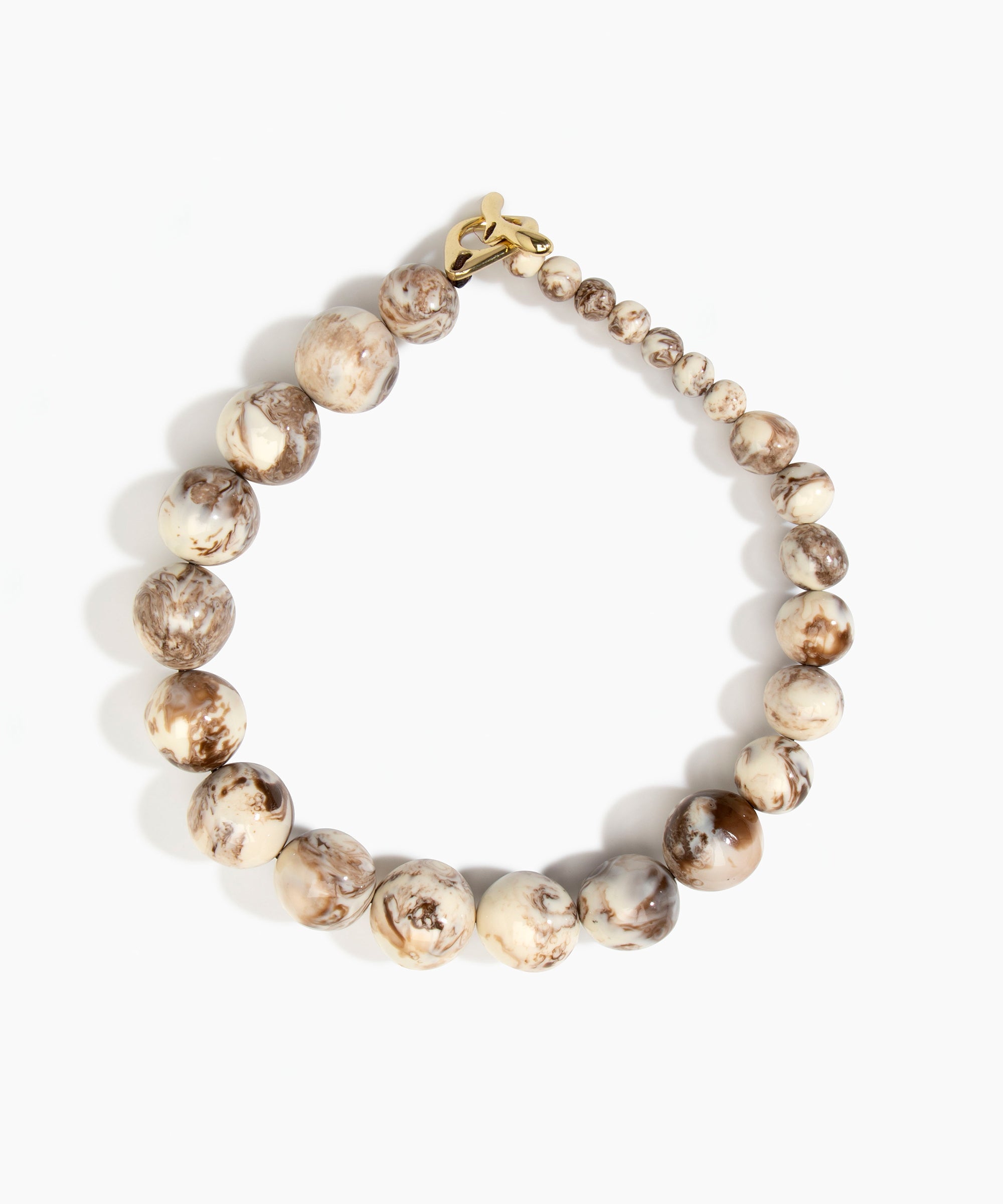 Dinosaur Designs Polished Organic Ball Choker in Cappuccino — handcrafted marbled cream and brown polished resin graduating bead choker necklace with brass t-bar clasp.
