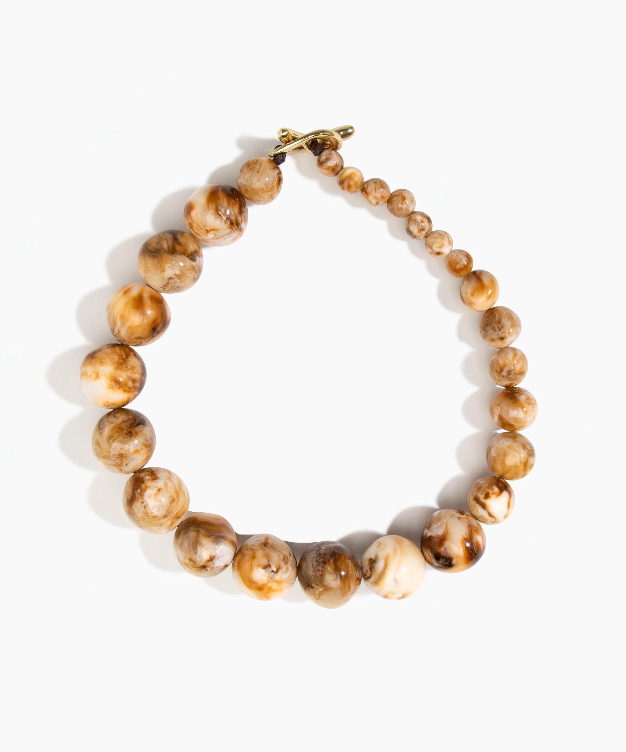 Dinosaur Designs Polished Organic Ball Choker in Light Horn — handcrafted marbled cream and brown polished resin graduating bead choker necklace with brass t-bar clasp.