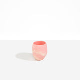 Dinosaur Designs Large Rock Cup in Blossom — handcrafted marbled pink and cream resin cup with rounded bulbous form and open organic rim
