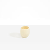 Dinosaur Designs Large Rock Cup in Cream — handcrafted cream resin cup with rounded bulbous form and open organic rim