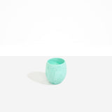 Dinosaur Designs Large Rock Cup in Mint — handcrafted marbled green blue and transparent resin cup with rounded bulbous form and open organic rim