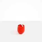 Dinosaur Designs Large Rock Cup in Poppy — handcrafted marbled red and transparent resin cup with rounded bulbous form and open organic rim