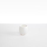 Dinosaur Designs Large Rock Cup in Snow Swirl — handcrafted marbled white and transparent resin cup with rounded bulbous form and open organic rim