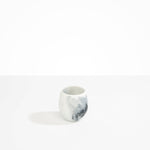 Dinosaur Designs Large Rock Cup in White Marble — handcrafted marbled white and black resin cup with rounded bulbous form and open organic rim