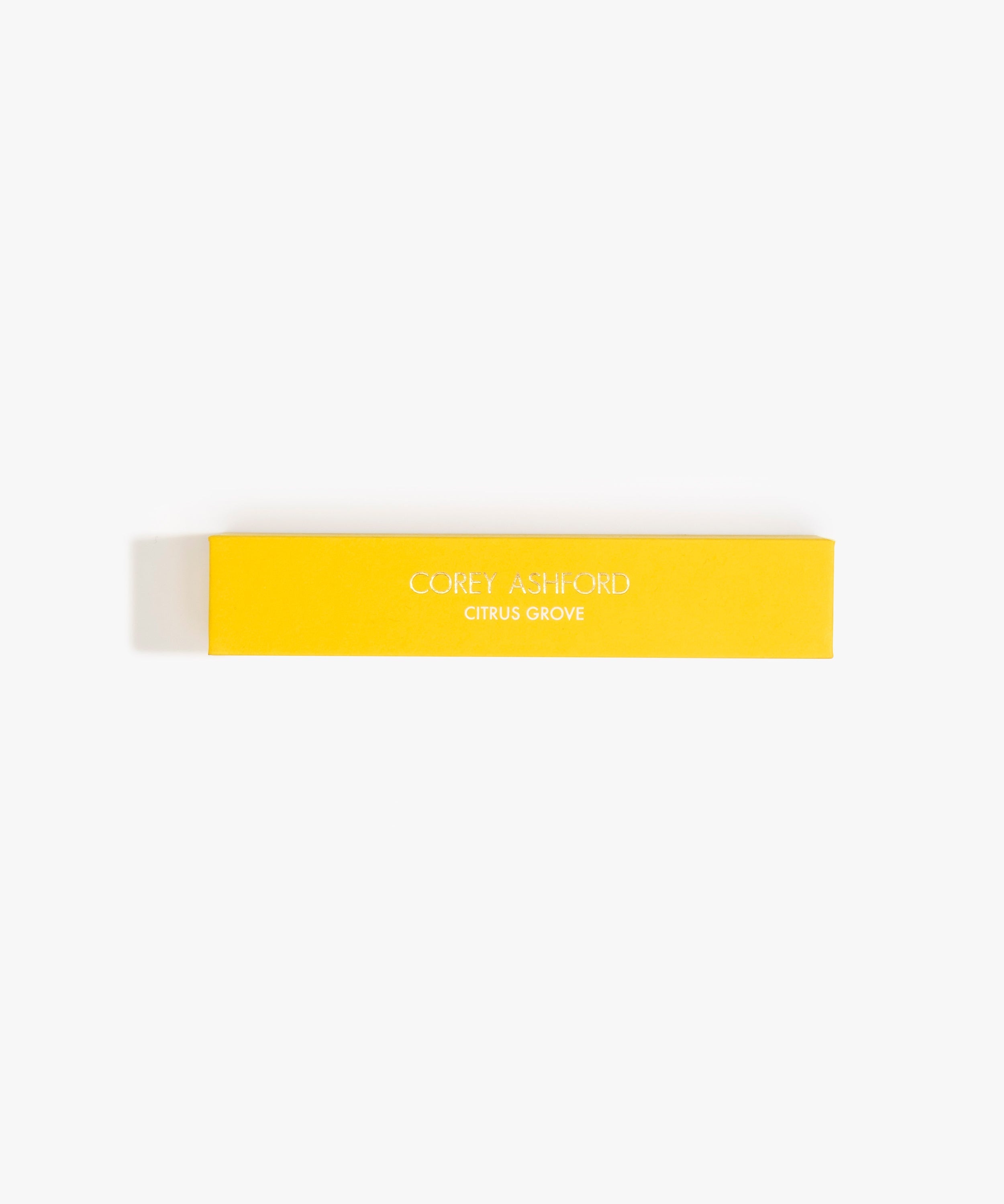 Dinosaur Designs Corey Ashford Citrus Grove Japanese Incense — yellow box of sandalwood, yuzu and orange scented incense sticks