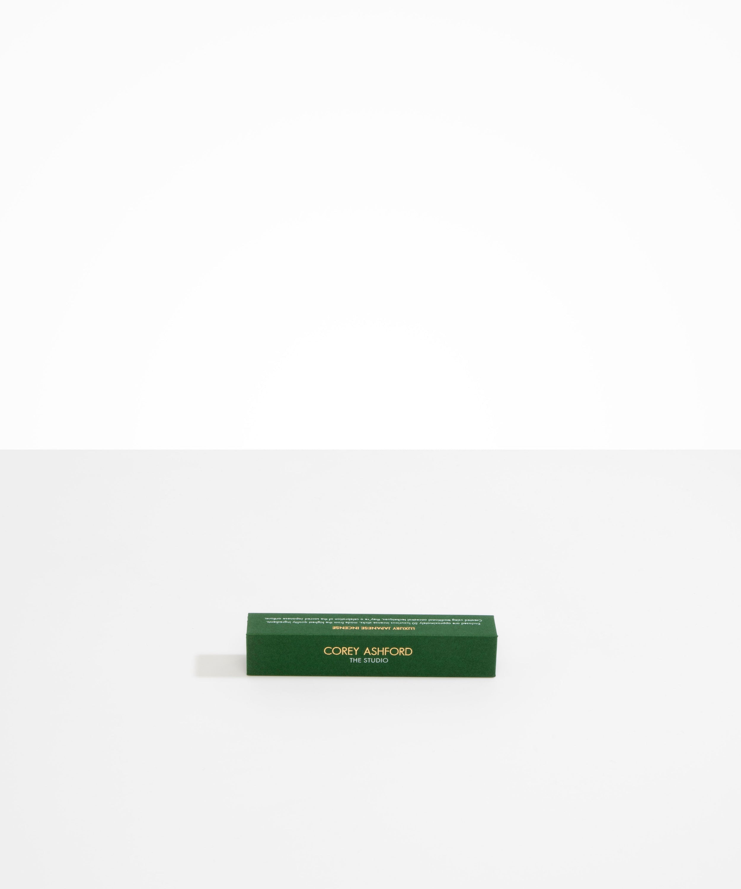 Dinosaur Designs Corey Ashford The Studio Japanese Incense — green box of labdanum, frankincense and charcoal scented incense sticks